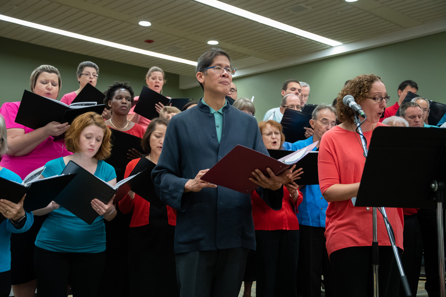 Paulist Father Ricky Manalo rehearses with a combined choir from the Baltimore and Washington archdioceses July 12 during the National Association of Pastoral Musicians convention in Baltimore July 12. The association named the priest Pastoral Musician of the Year.